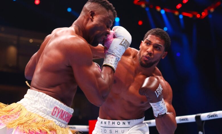 RIYADH, SAUDI ARABIA - MARCH 08: Anthony Joshua punches Francis Ngannou during the Heavyweight fight between Anthony Joshua and Francis Ngannou on the Knockout Chaos boxing card at the Kingdom Arena on March 08, 2024 in Riyadh, Saudi Arabia. (Photo by Richard Pelham/Getty Images