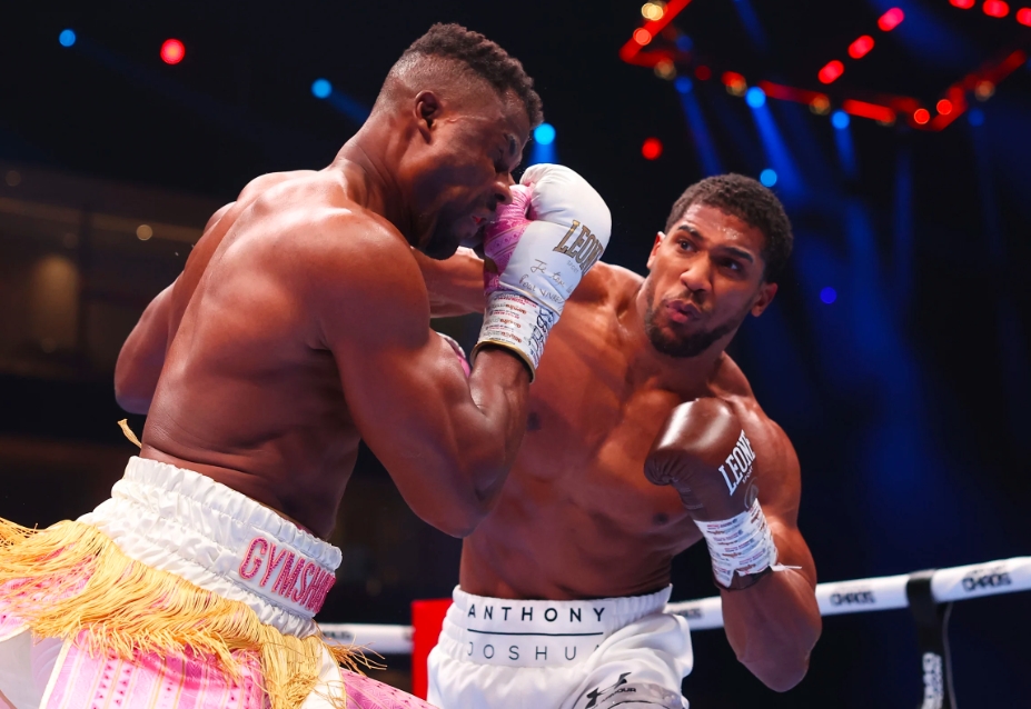 RIYADH, SAUDI ARABIA - MARCH 08: Anthony Joshua punches Francis Ngannou during the Heavyweight fight between Anthony Joshua and Francis Ngannou on the Knockout Chaos boxing card at the Kingdom Arena on March 08, 2024 in Riyadh, Saudi Arabia. (Photo by Richard Pelham/Getty Images